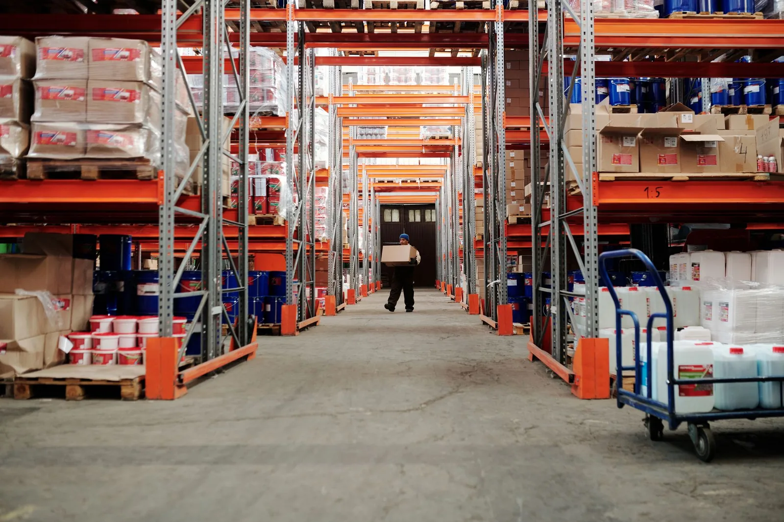 A warehouse aisle lined with racking in a fulfilment centre